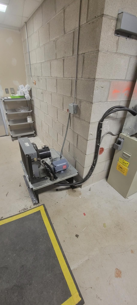 improperly installed oil cooler with hoses and cables unprotected