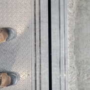looking down at elevator car door and hall door sills