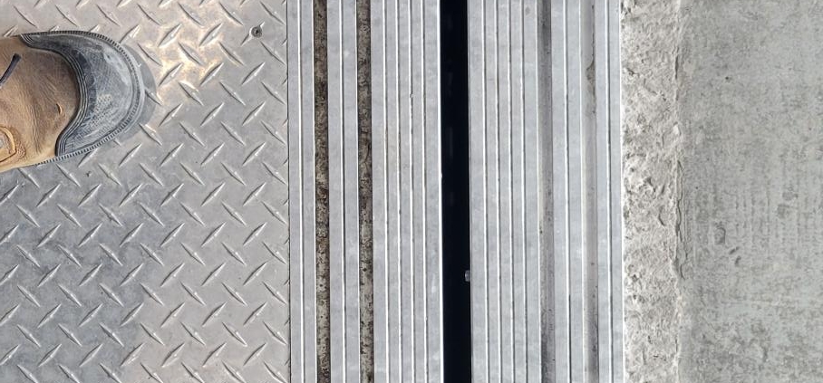 looking down at elevator car door and hall door sills