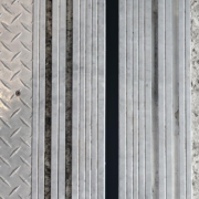 Elvator car door and hall door sills filled with debris