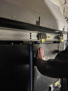 maintaining the door roller on a commercial elevator in a UHaul facility